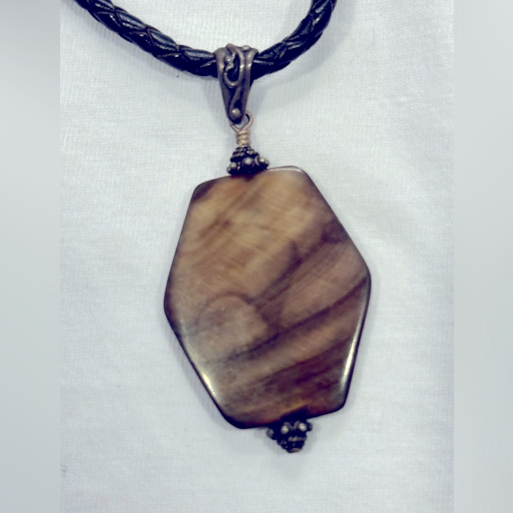 Geometric pendant on leather braided cord necklace